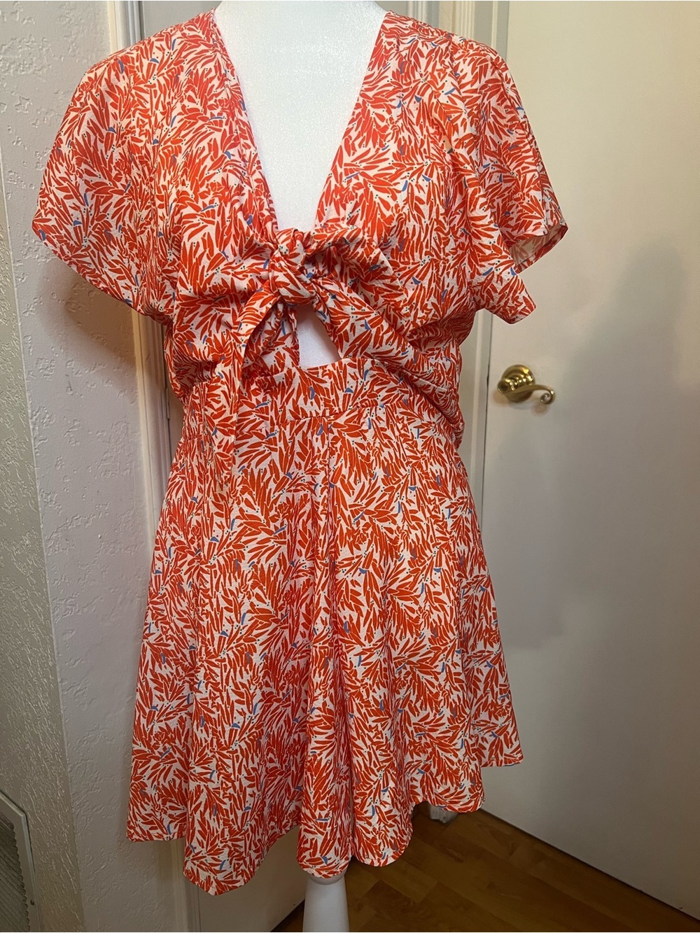 Tie-Front romper in Bright Orange Leaf Print